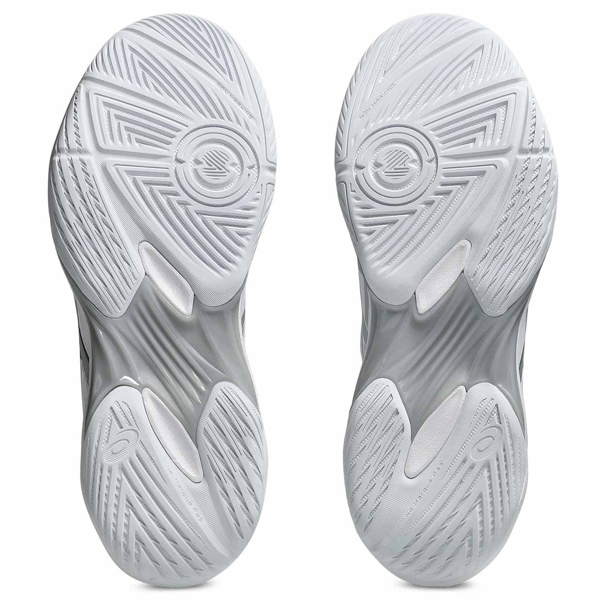 Close-up of gray athletic shoes with sole pattern on a white background