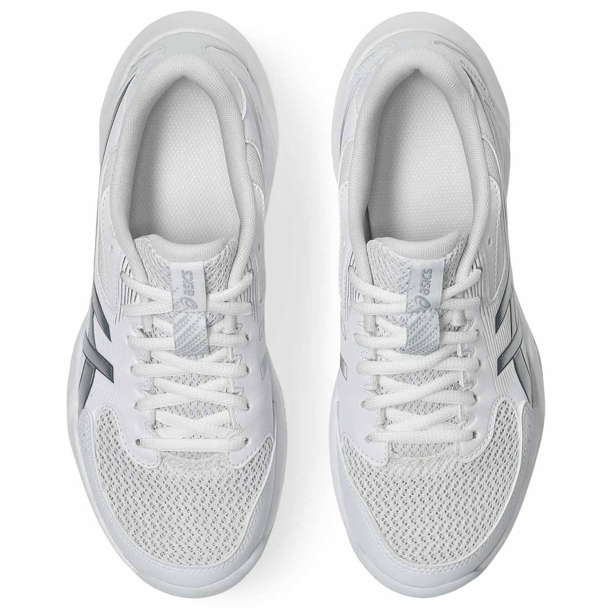 Pair of white athletic shoes on a white background