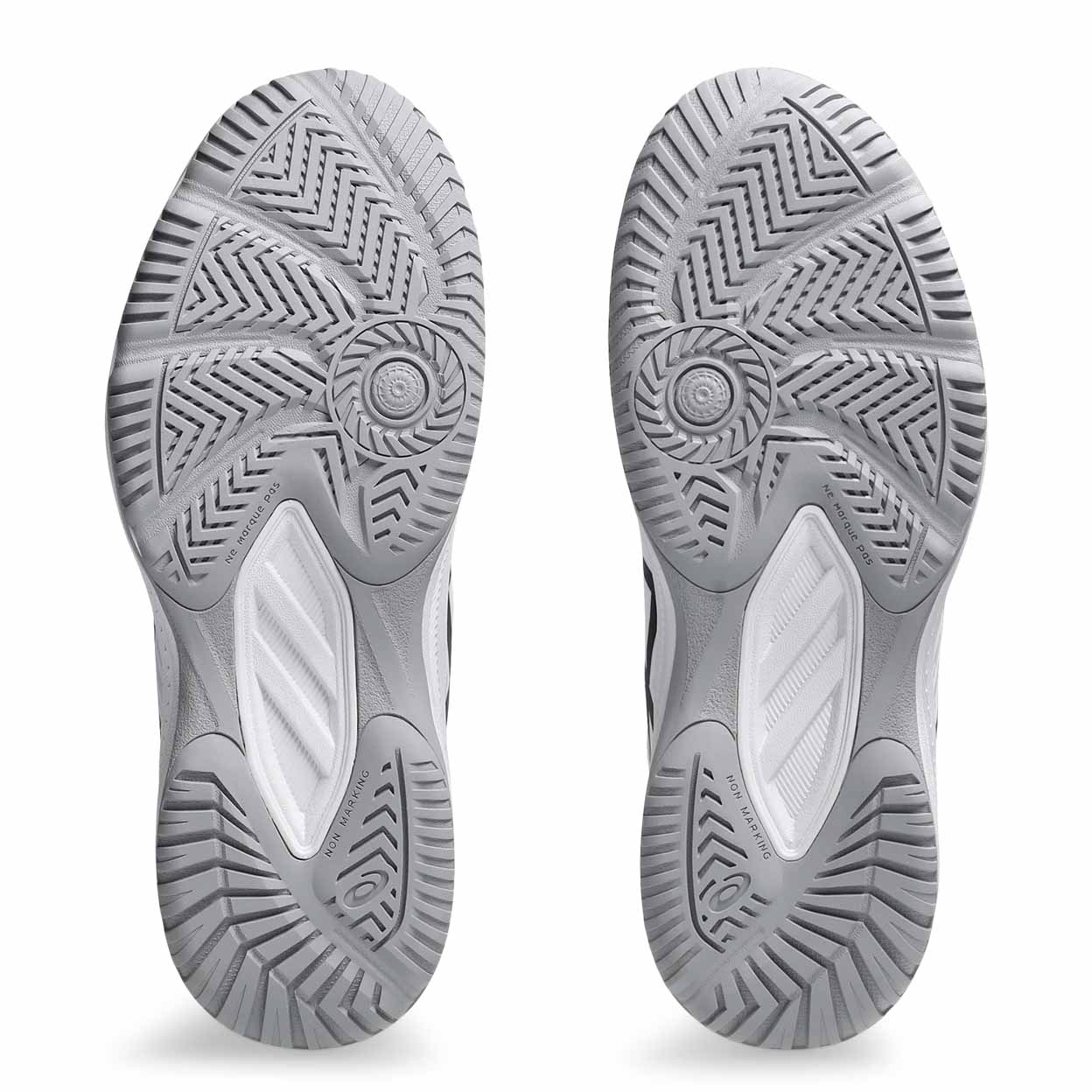 Close-up of gray athletic shoes with tread pattern on a white background