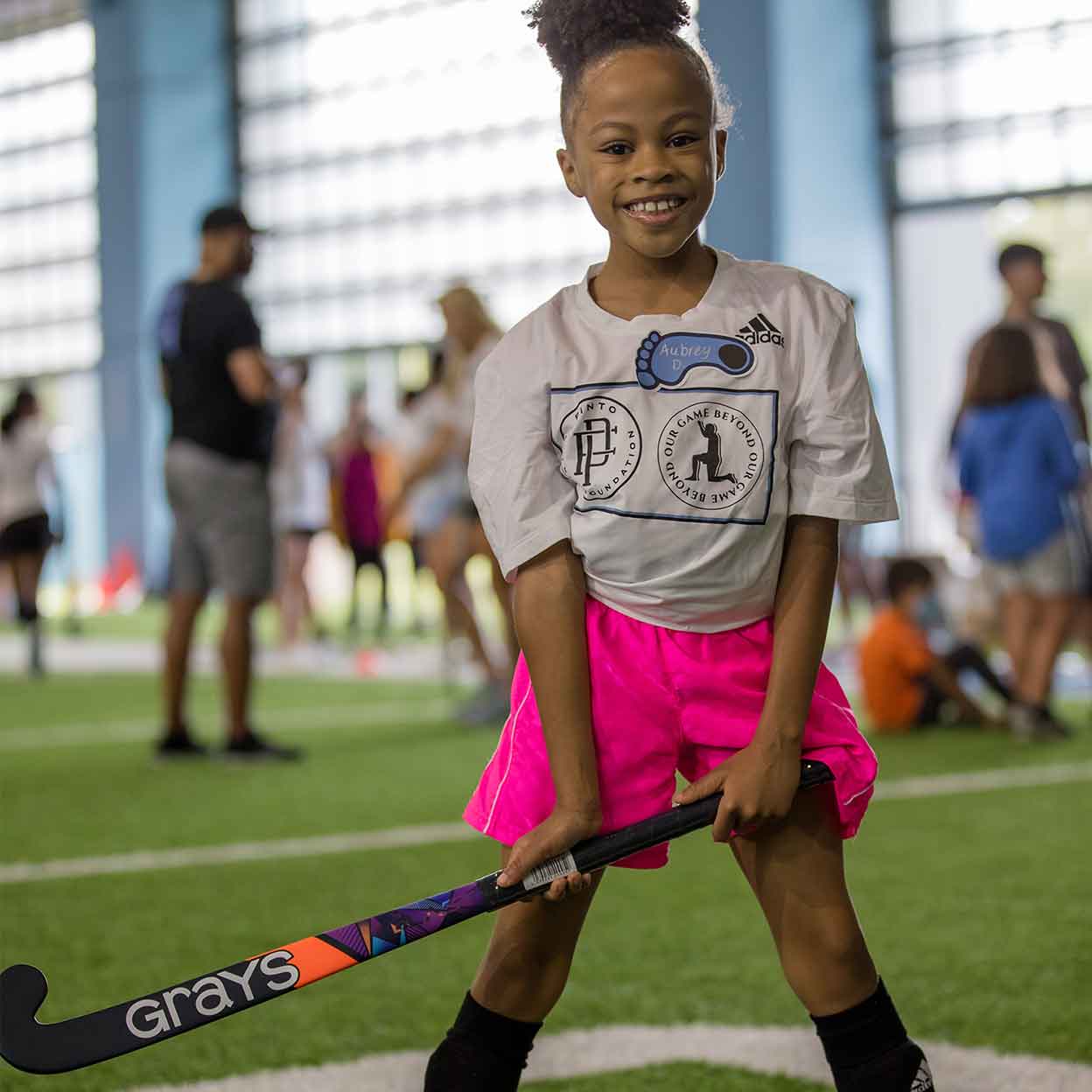 young girl playing with the Grays Blast Wood Field Hockey Stick
