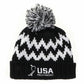 Black and white patterned beanie with pom-pom and USA Field Hockey logo on a white background