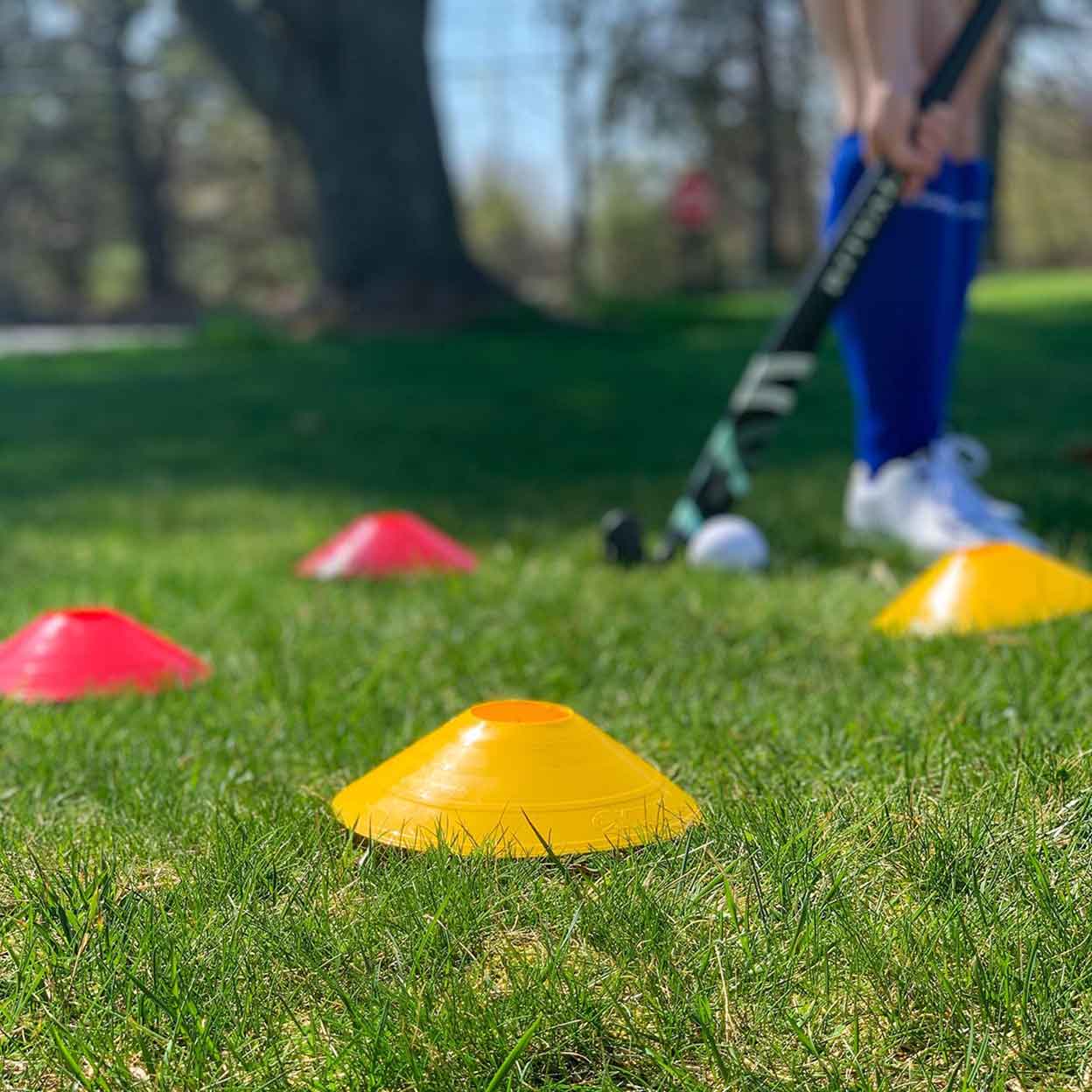 field hockey player on field with Kwik Goal Small Disc Cones