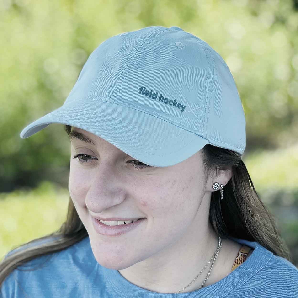 Girl wearing a Field Hockey Relaxed Twill Trucker hat