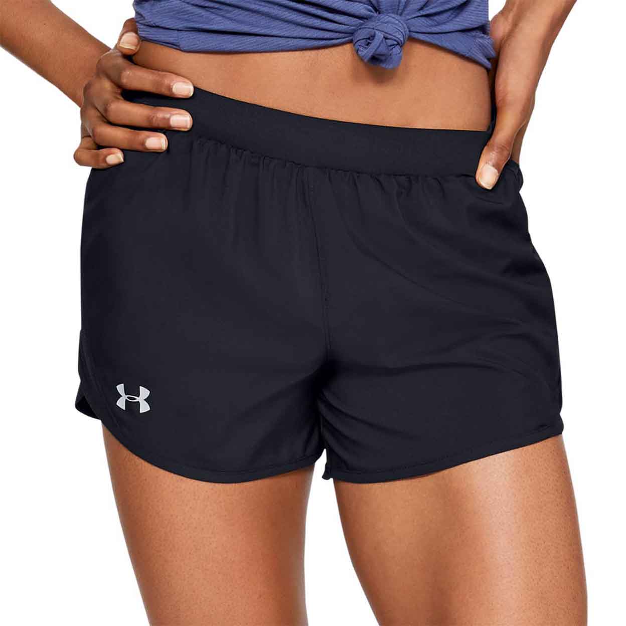 Front of the model wearing the Under Armour Women'S Fly By 2.0 Shorts both hands on hips.