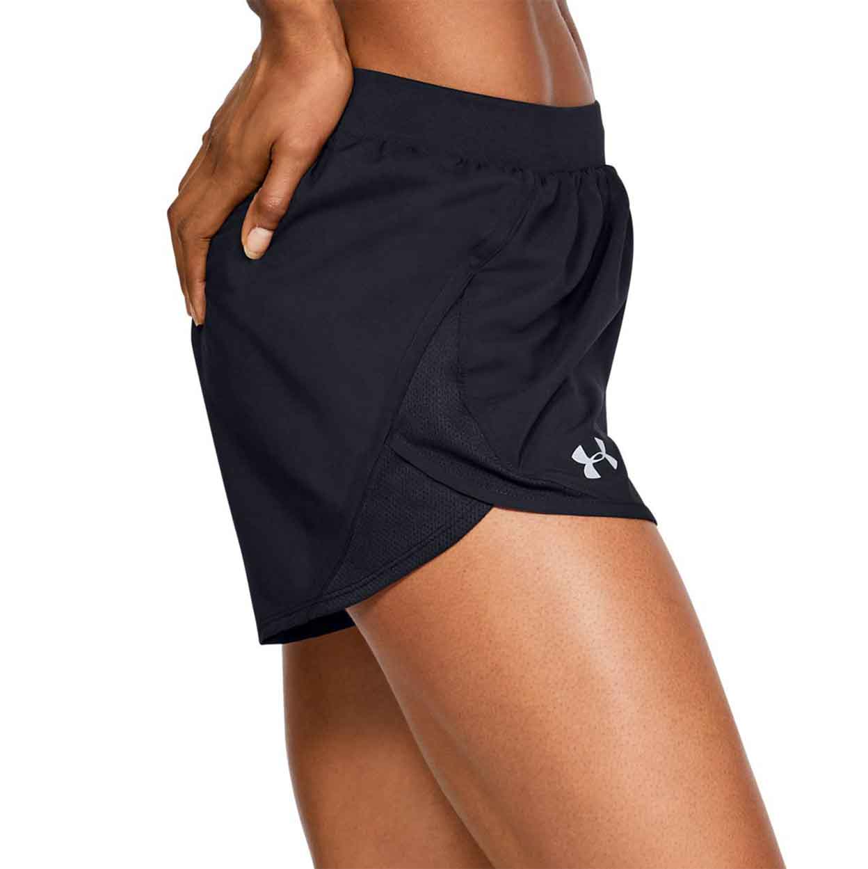 Side of model wearing the Under Armour Women'S Fly By 2.0 Shorts with one hand on her hip.