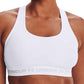 Front of a model wearing the white Under Armour Crossback Mid Bra.