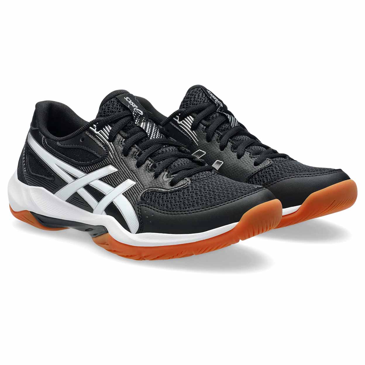 Black and orange athletic shoes on a white background