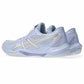 Light blue lightweight ASICS athletic shoes for field hockey with gold accents on a white background