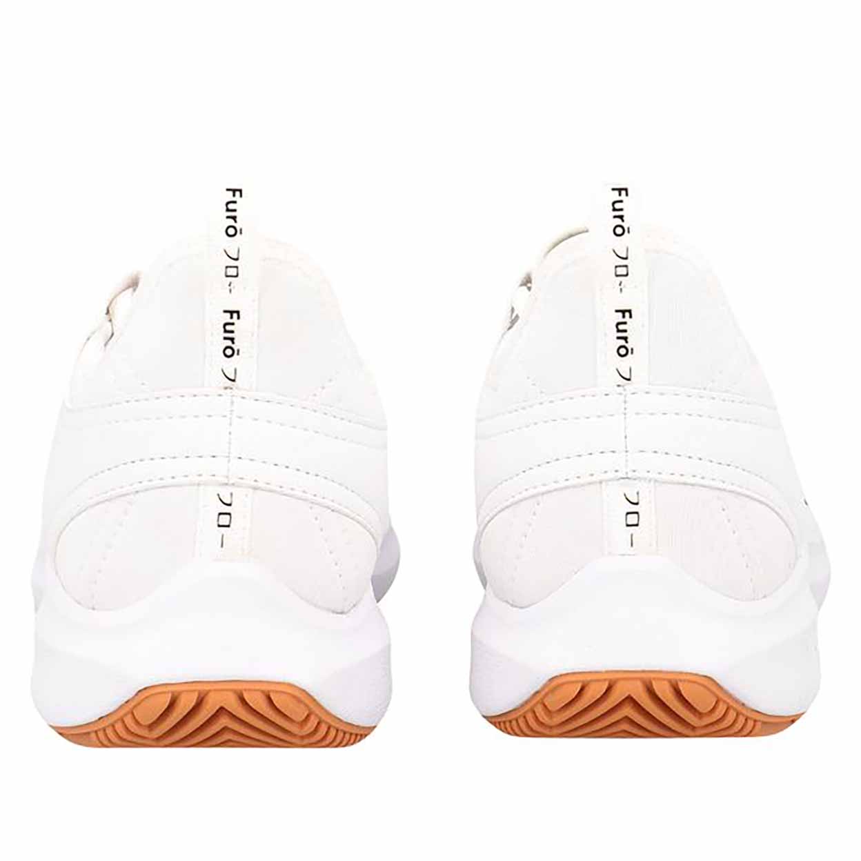 White shoes with brown soles on a white background