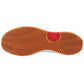 Close-up of a shoe sole with a red logo on a white background