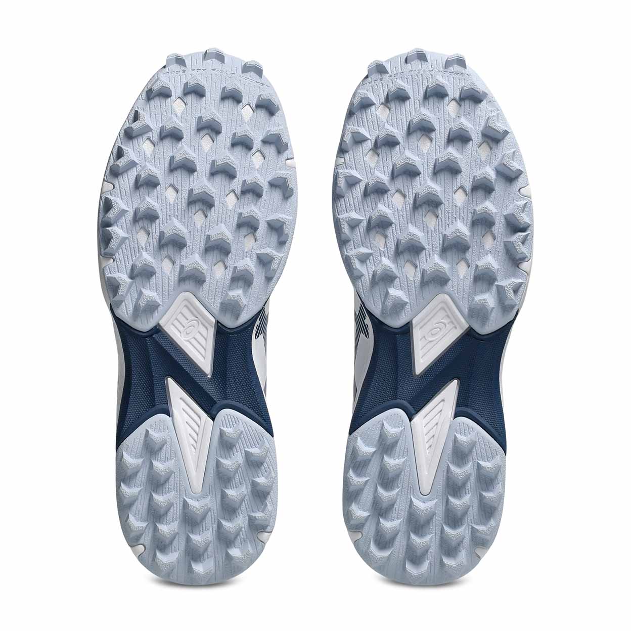 The outsoles of a pair of athletic shoes, showing a light gray and white tread pattern with dark navy blue sections, photographed on a clean white background.