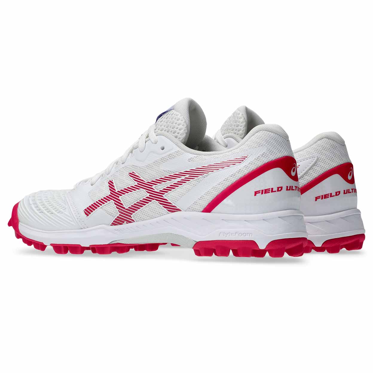 Back-angled pair of white ASICS Field Ultimate FF 2 turf shoes with pink logo detailing