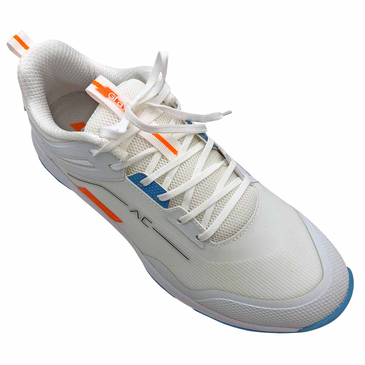 White athletic shoe with orange accents on a white background