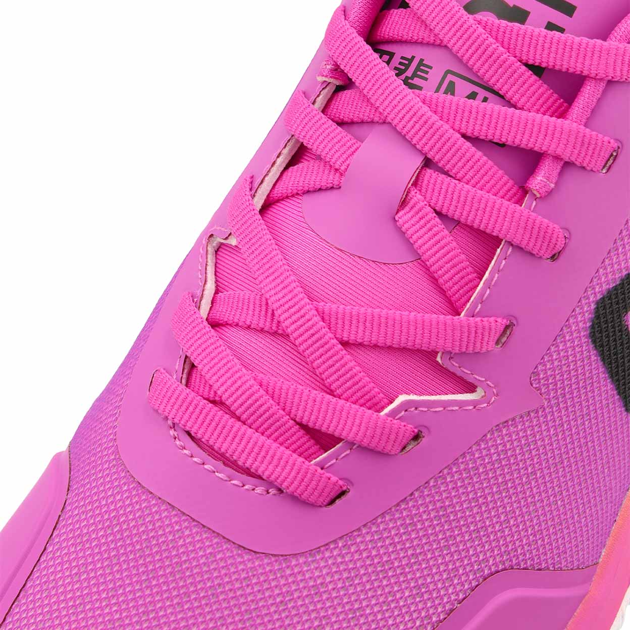 Close-up of a pink athletic shoe with pink laces on a white background