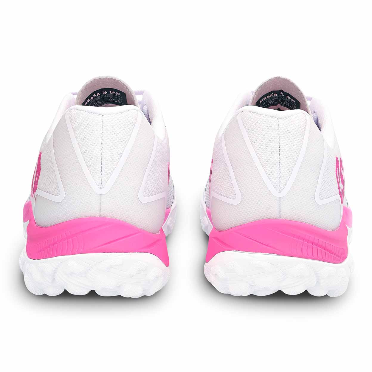 White turf shoes with pink soles on a white background