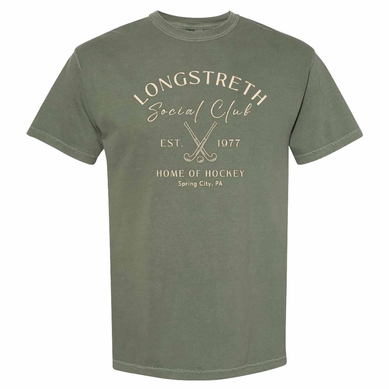 Olive green T-shirt with 'Longstreth Social Club' printed above two crossed field hockey sticks and text reading 'Est. 1977 Home of Hockey, Spring City, PA' in beige lettering.