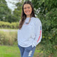 Model wearing the white USA Field Hockey Pigment Dyed Long Sleeve Tee