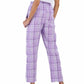 Back of a model wearing Purple plaid lounge pants with a white drawstring waist and a white 'USA Field Hockey' logo on the left leg, shown against a plain white background.