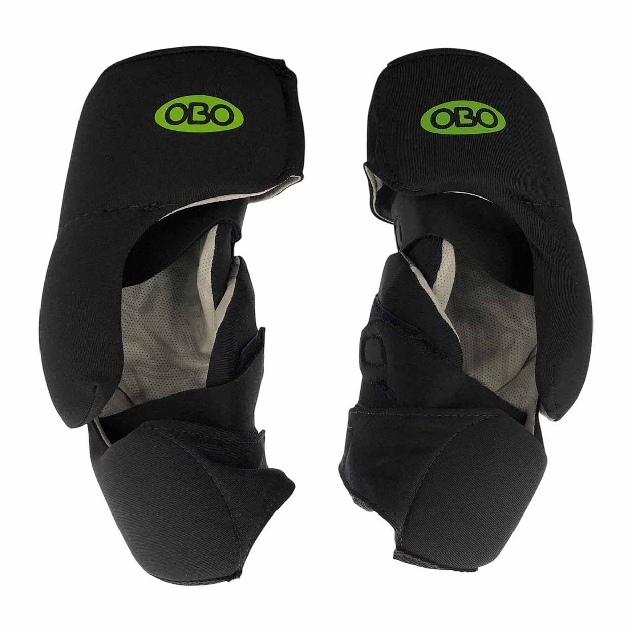 A pair of black OBO Robo Lite elbow guards shown side by side, with the interior mesh lining visible. Each guard has an OBO logo in green on the upper protective pad.