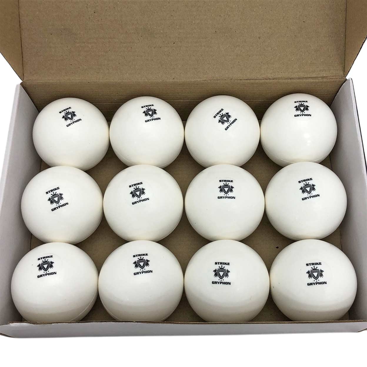 One dozen white Gryphon Super All-Turf Field Hockey Balls in a box.