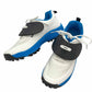 White and blue athletic shoes with black soles on a white background