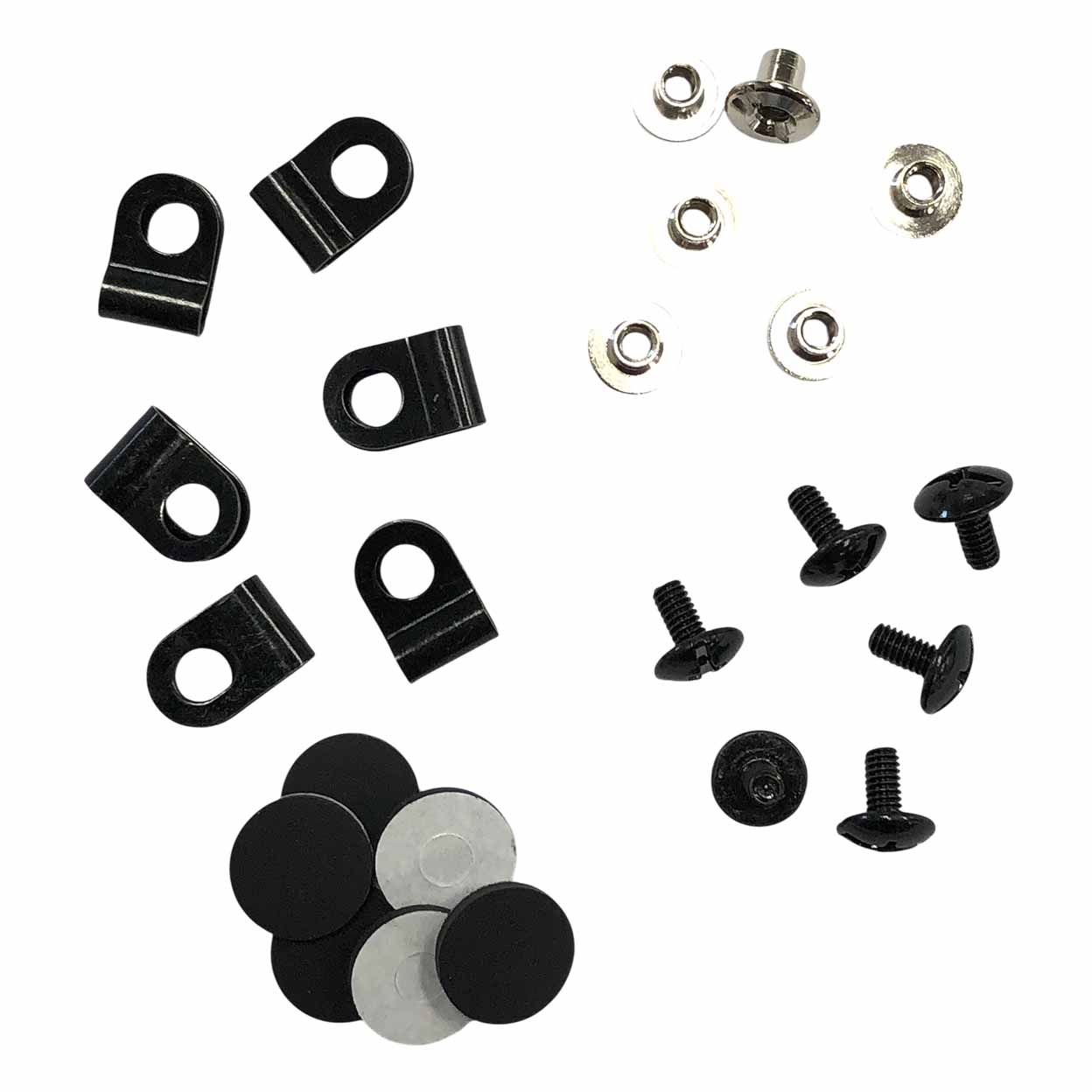 Collection of black and silver metal fasteners on a white background