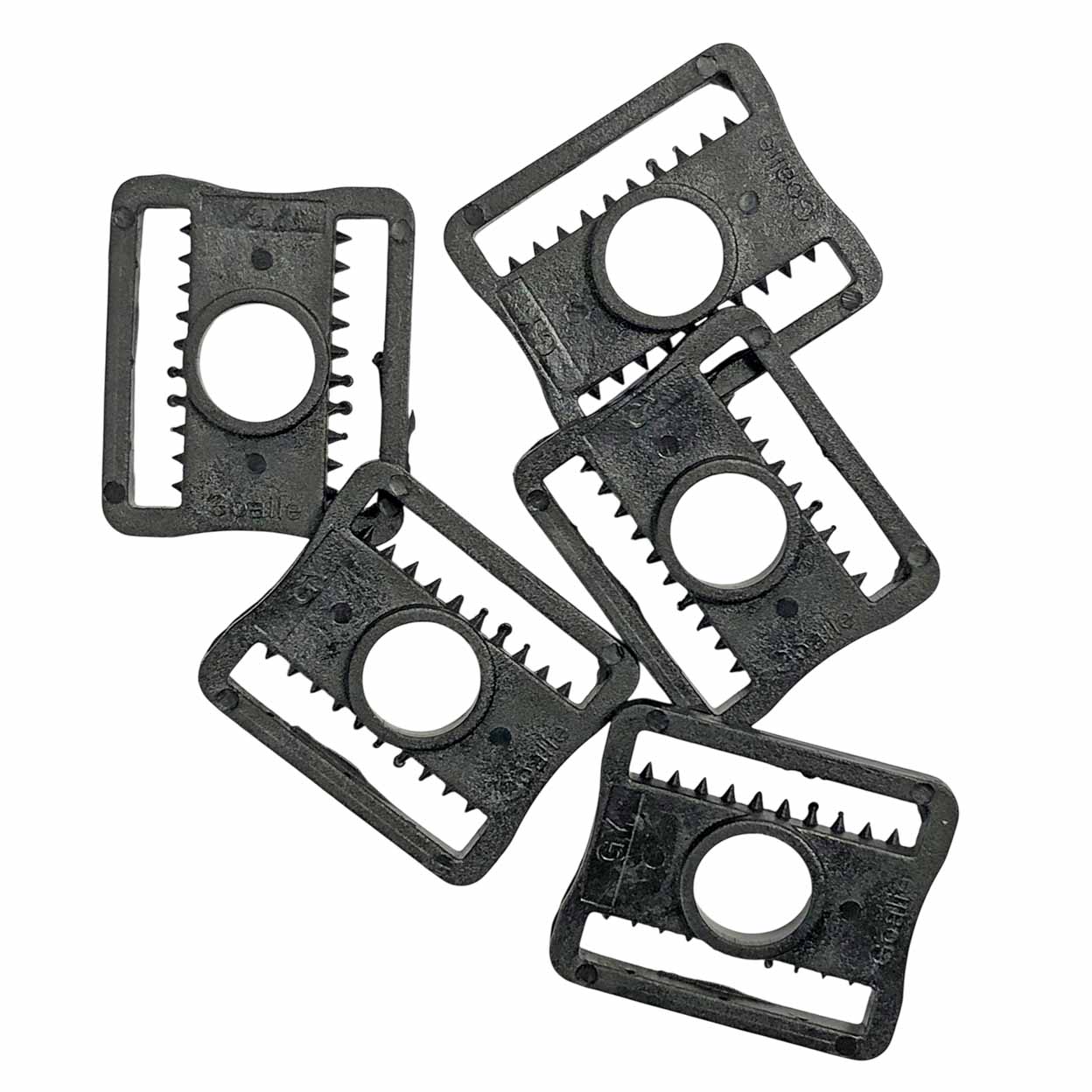 Five black plastic replacement parts with a circular center hole and serrated edges, arranged on a plain white background.