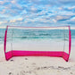 Blockstar Pink Outdoor Goal on the Go front view on the beach