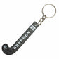 Keychain shaped like a hockey stick with 'Gryphon' branding on a white background