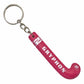Pink keychain shaped like a hockey stick with 'Gryphon' branding on a white background