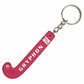 Pink keychain shaped like a hockey stick with 'Gryphon' branding on a white background