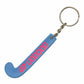 Blue keychain shaped like a hockey stick with red text on a white background