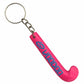 Pink keychain shaped like a hockey stick with 'Voodoo' branding on a white background