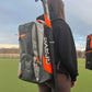 person wearing the Grays XI-X Backpack with a stick on the side of the bag.