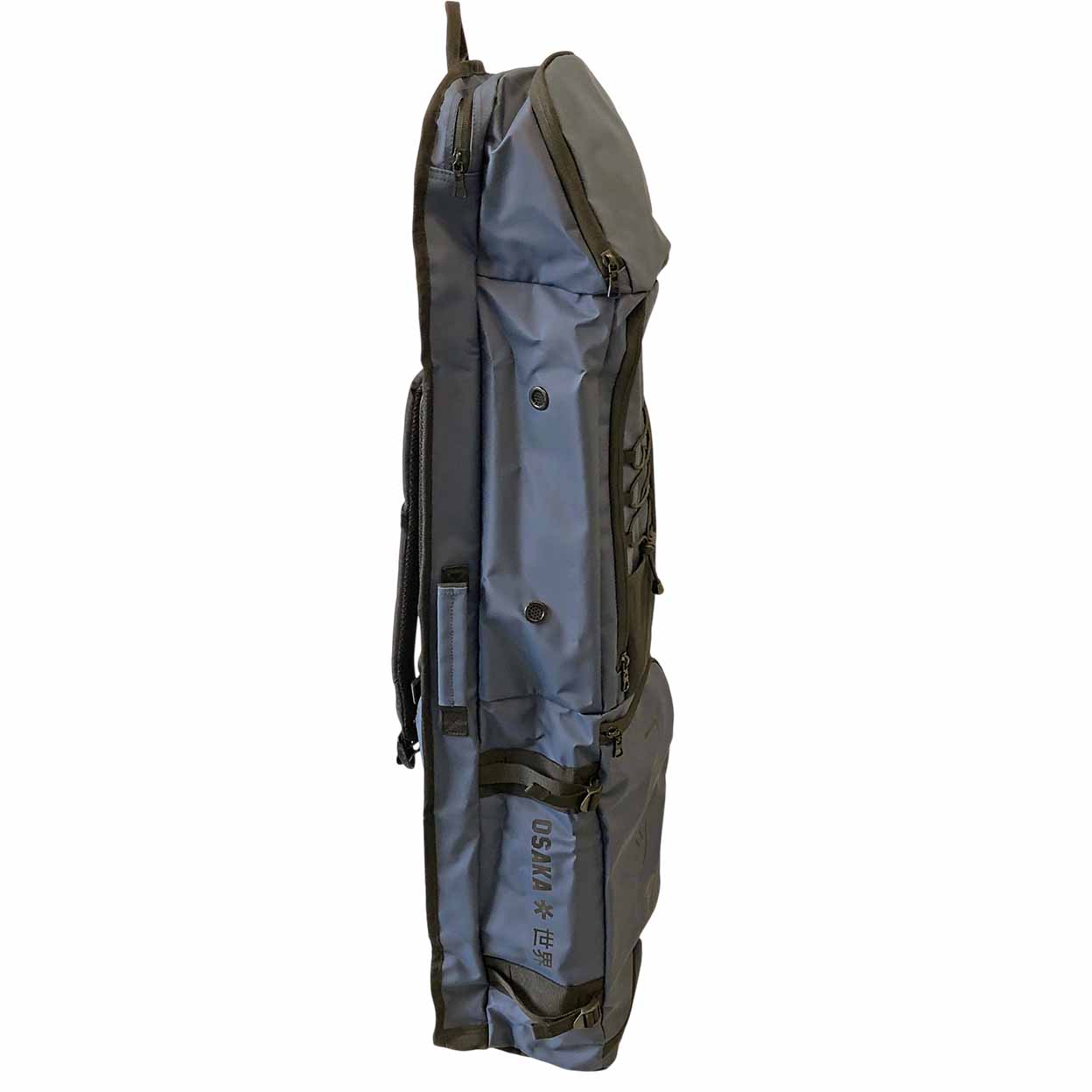 A navy and black soft-sided gear bag shown upright against a plain white background, with multiple zip compartments and a vertical printed marking reading 'Osaka'.