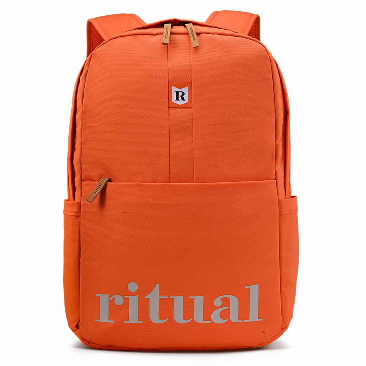 Orange backpack with 'ritual' branding on a white background