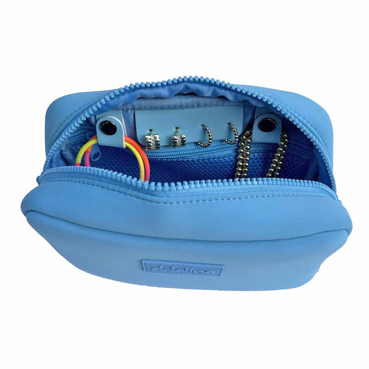 Blue jewelry case with jewelry items on a white background