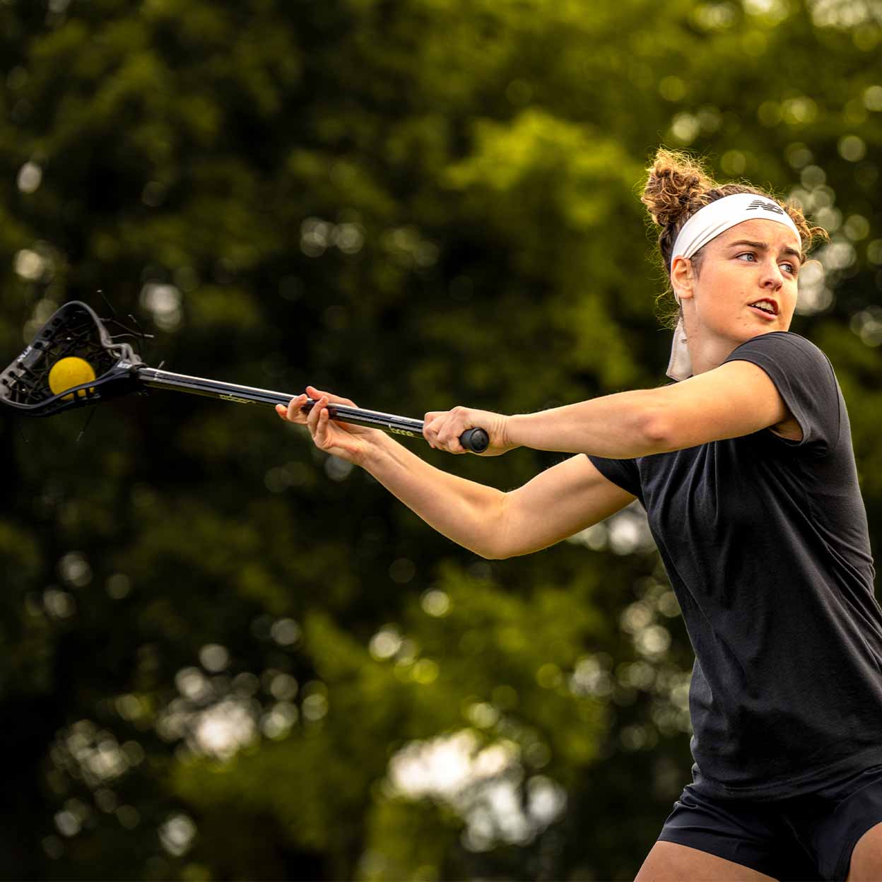 lacrosse player playing with the Brine Edge Pro Plus Complete Stick