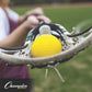 yellow game ball in the pocket of a lacrosse stick