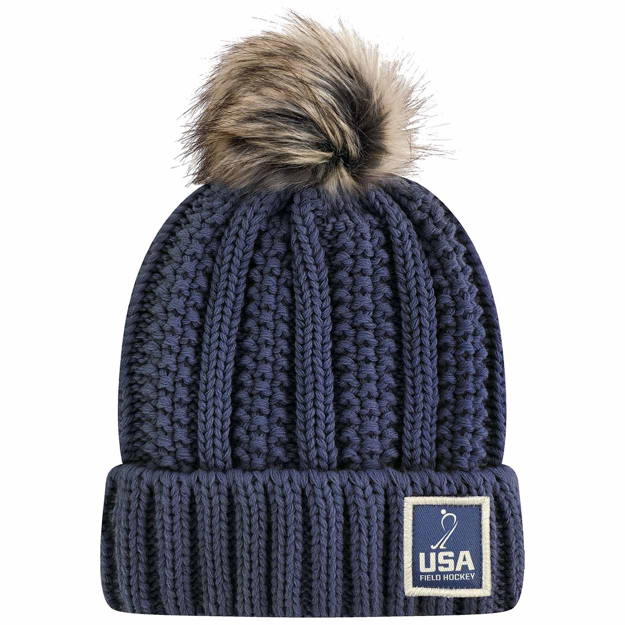 Navy blue knit pom-pom beanie with a USA Field Hockey patch on the cuff.