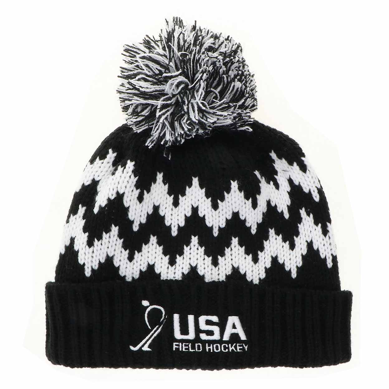 Black and white patterned beanie with pom-pom and USA Field Hockey logo on a white background