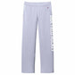 A pair of light blue women's athletic pants with an open bottom hem and a relaxed fit. The pants feature front pockets and the words 