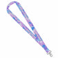 A fabric lanyard strap with a tropical leaf pattern in shades of blue, purple, and pink, featuring the text 'LONGSTRETH' in light pink. The strap is shown diagonally with a silver metal lobster clasp at the bottom left, set against a plain white background.