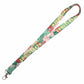 Lanyard with floral design and text on a white background