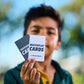 young man holding up a couple of MatchPlay Cards