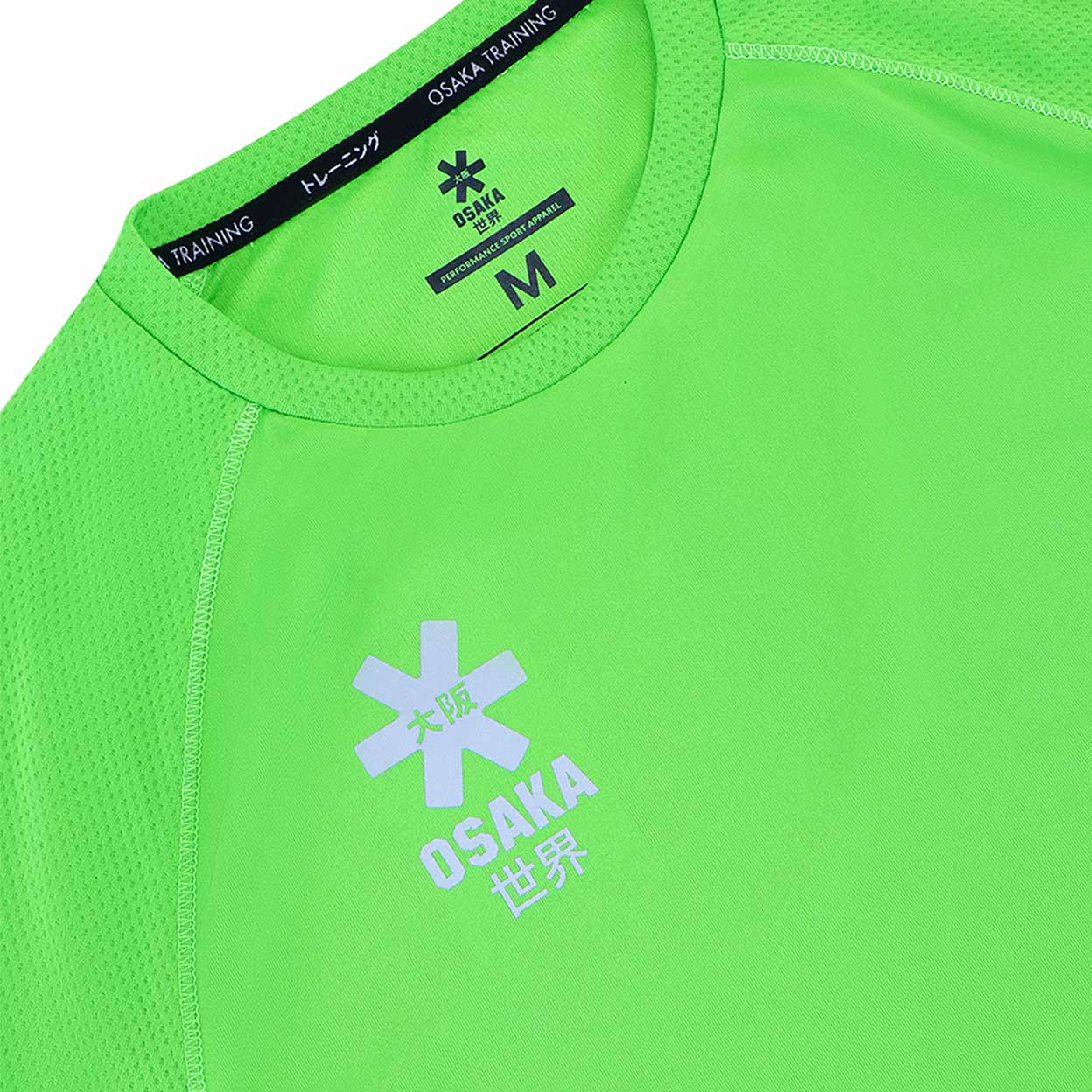 Close-up of a green athletic shirt with Osaka Training logo