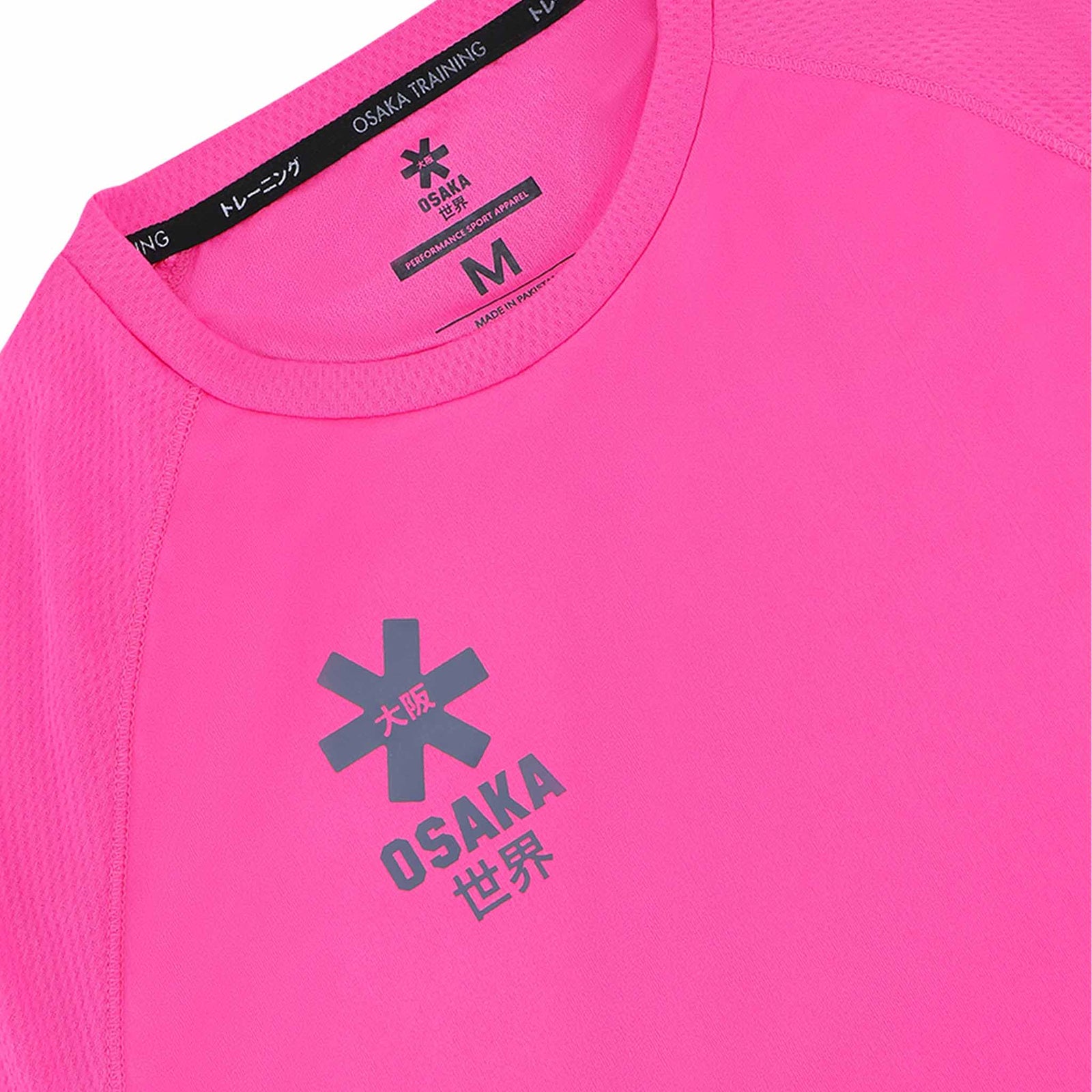 Close-up of a pink athletic shirt with 'Osaka' branding on a white background