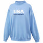 A light blue crewneck sweatshirt with 'USA FIELD HOCKEY' printed on the chest, shown against a plain white background.