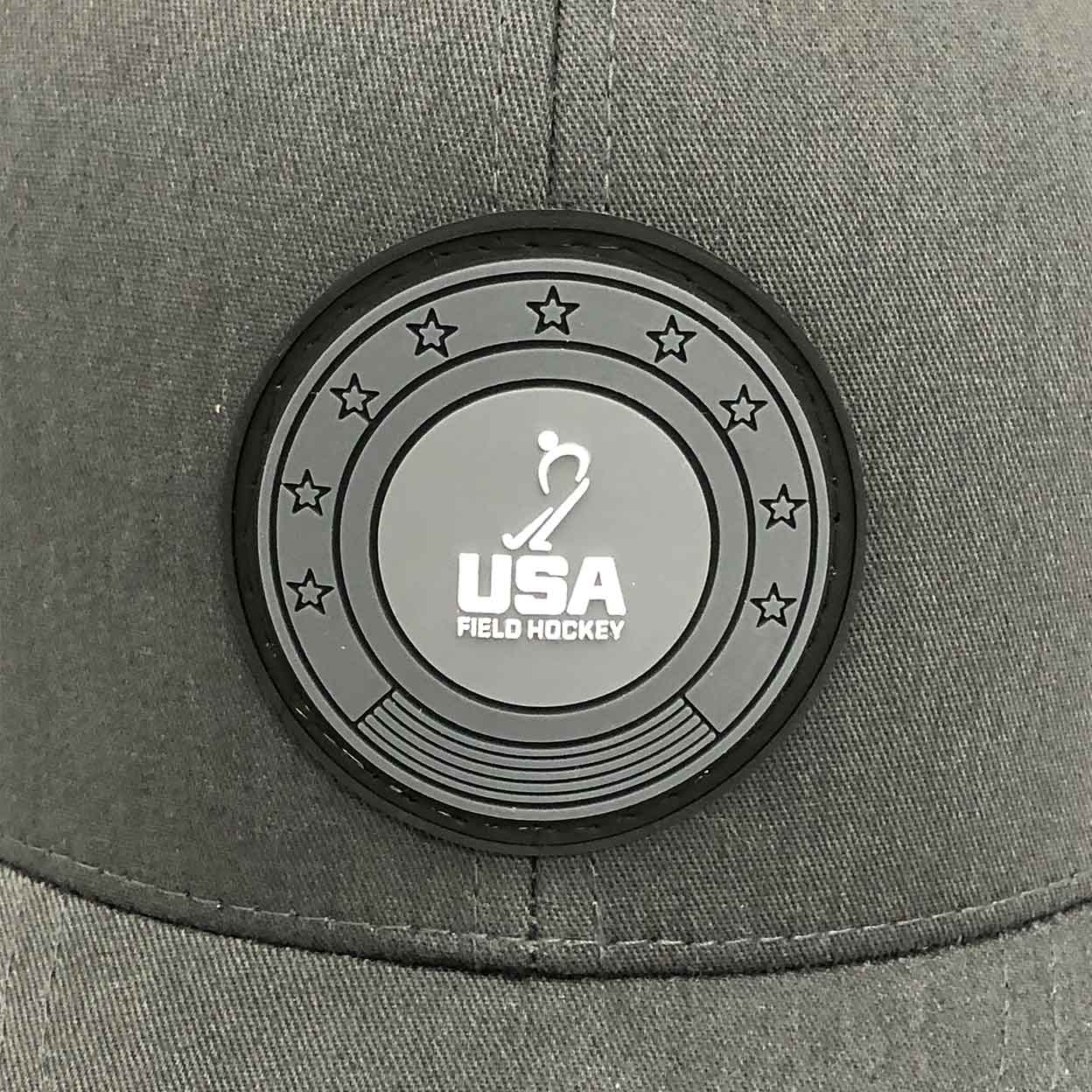 Close up of the silicon patch on the USA Field Hockey Trucker Hat