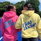 Two models showing the bakc of the Field Hockey Hooded Sweatshirts